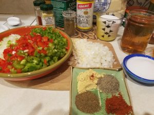 Jalapeno and bell peppers, onions, garlic, paprika, celery seed, black pepper, dry mustard, salt, vinegar and sugar.